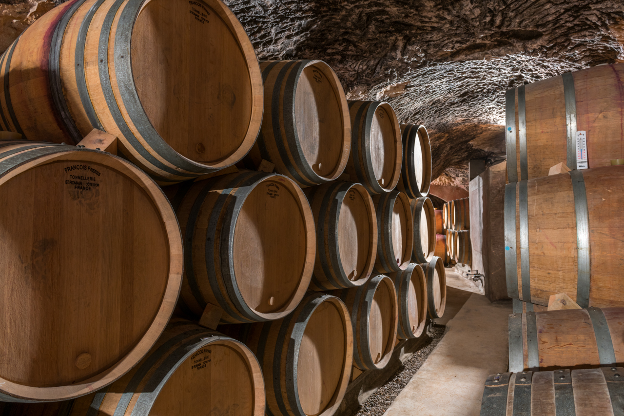 Each barrel is transported painstakingly down into the subterranean cellar